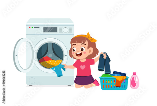 happy cute kid do laundry with washing machine