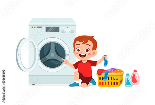 happy cute kid do laundry with washing machine