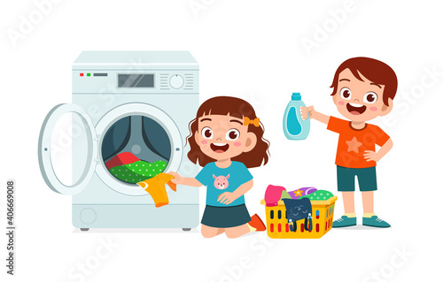 happy cute kid do laundry with washing machine