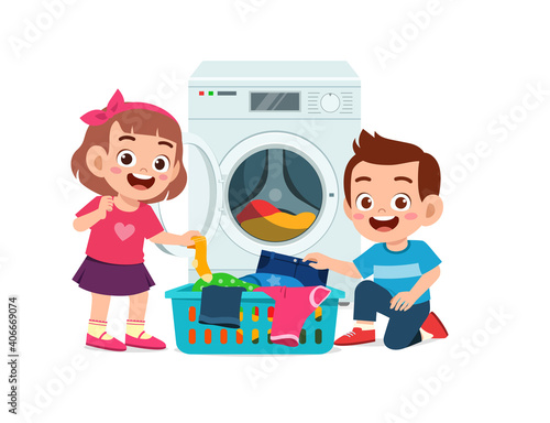 happy cute kid do laundry with washing machine