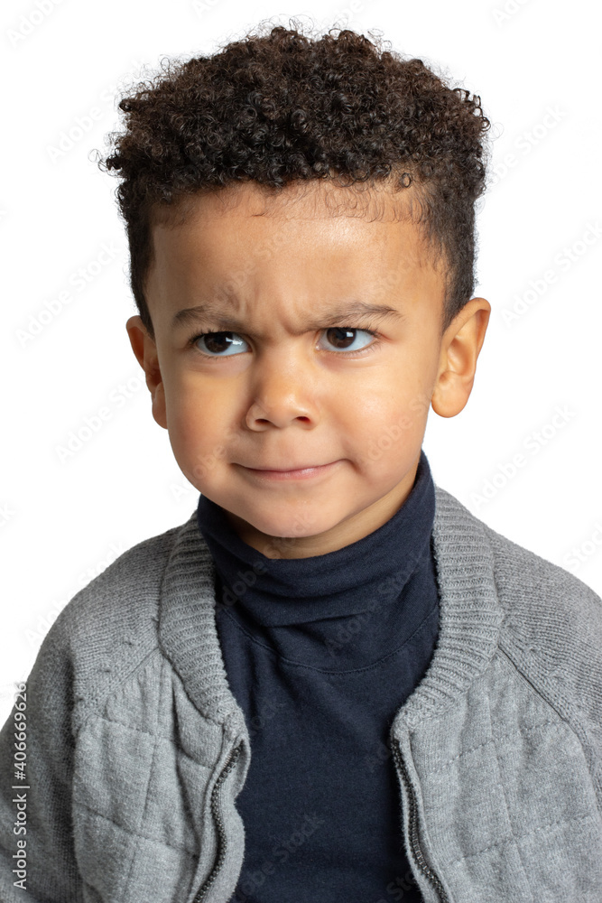 Little afro american boy frowning with angry facial expression. Little afro american boy frowning with angry facial expression.
