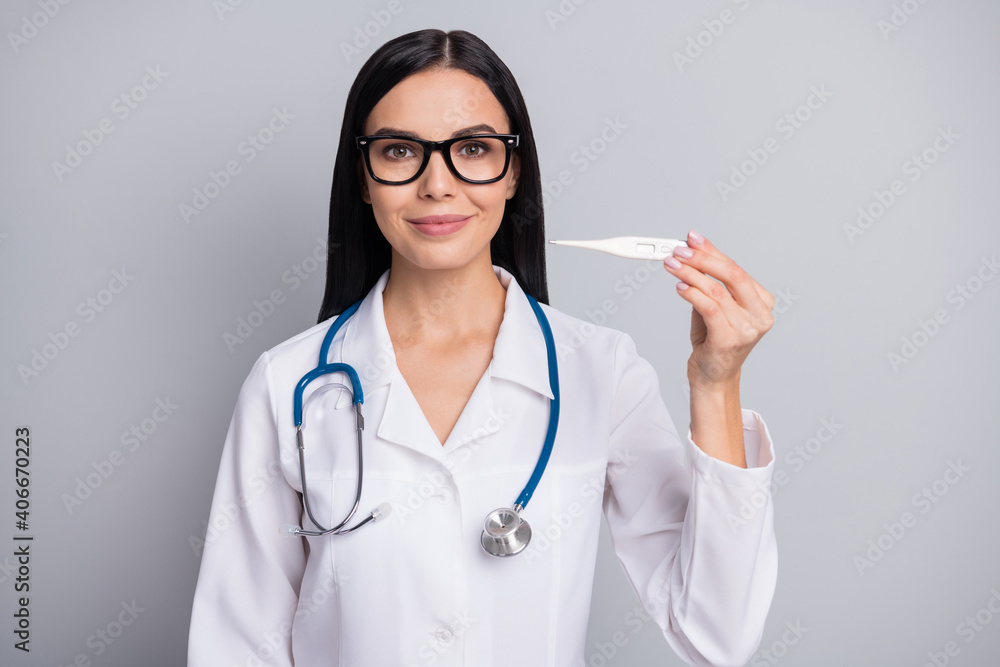 Photo of doctor lady hold thermometer wear spectacles stethoscope white uniform isolated grey color background Photo of doctor lady hold thermometer wear spectacles stethoscope white uniform isolated grey color background