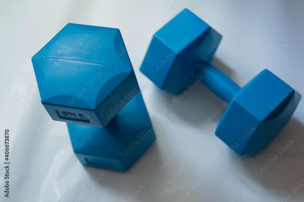 blue dumbbell isolated on white blue dumbbell isolated on white