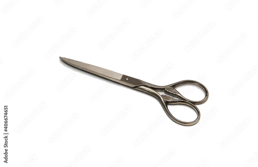 Silver metal scissors on a white background Silver metal scissors on a white background