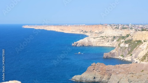 Baunty beach on cape Fiolent in Balaklava, Crimea. View from the top of the rock. azure sea, sunny day clear sky background. The concept of perfect place for summer travel and rest. 