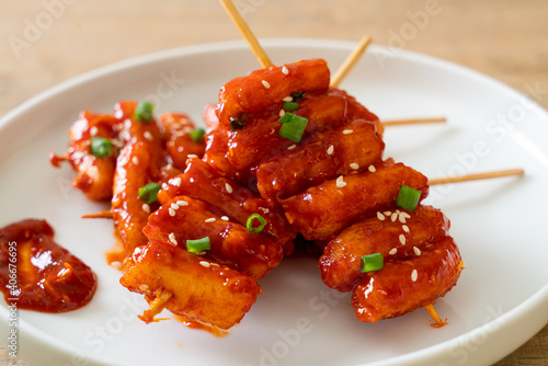 deep fried Korean rice cake (Tteokbokki) skewered with spicy sauce photo