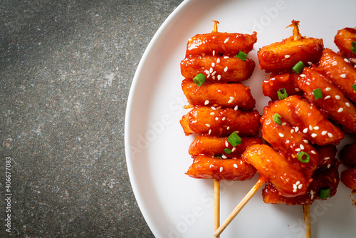 deep fried Korean rice cake (Tteokbokki) skewered with spicy sauce photo