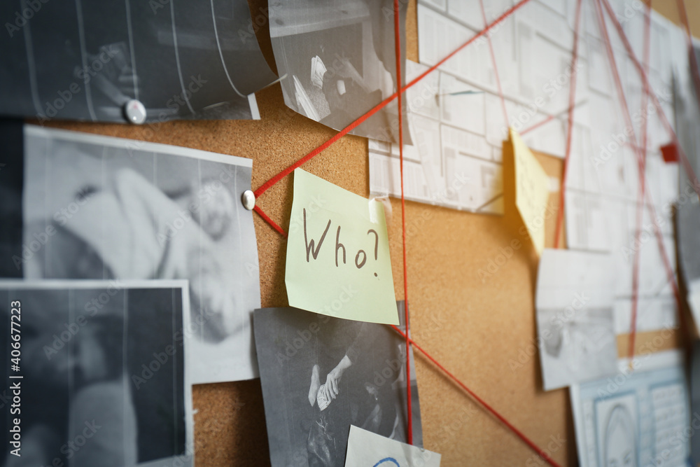 © New Africa - Detective board with sticker, crime scene photos and red threads, closeup