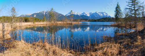 idyllic moor lake Barmsee, with blue water, view to Karwendel alps, upper bavaria