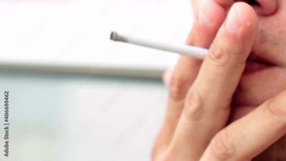 man lights a cigarette close up man lights a cigarette close up