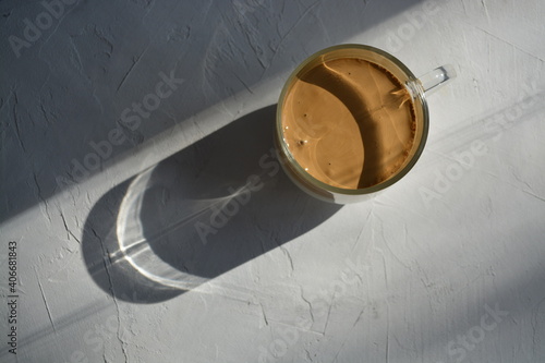 Dalgon coffee on a gray background. hard light. Minimum composition. View from above, copy space photo