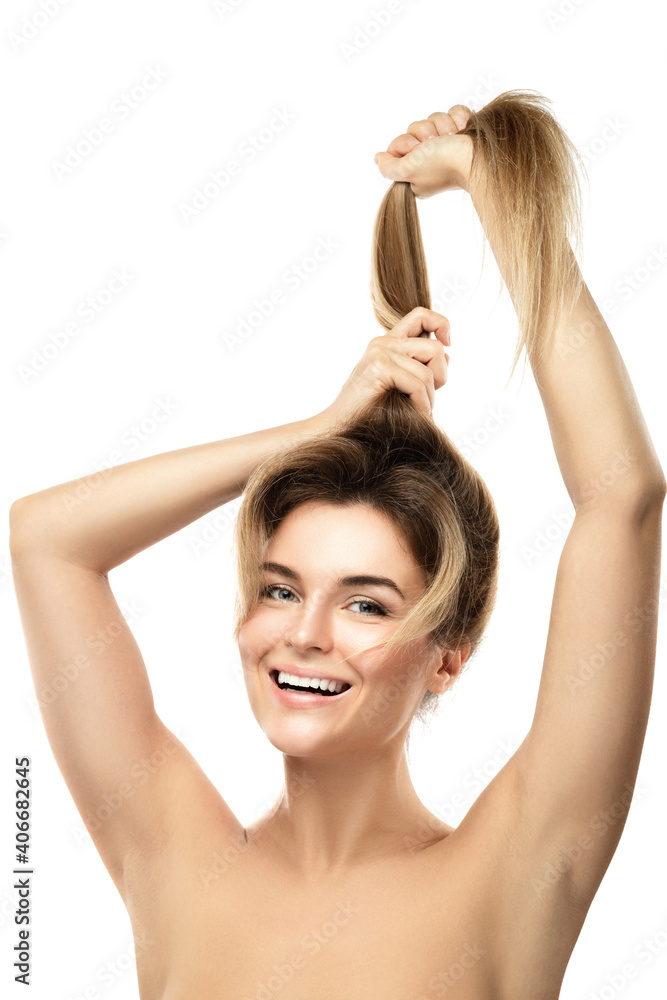 Fototapeta premium Beautiful woman is very happy of her hair growth progress