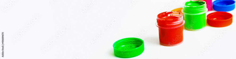Gouache Paint cans on a white background. copy space. banner Gouache Paint cans on a white background. copy space. banner