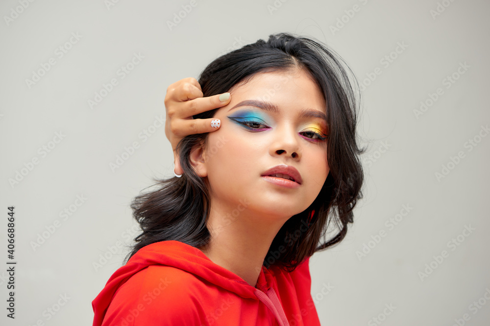 Beauty model girl with colorful eyeshadow on white background Beauty model girl with colorful eyeshadow on white background