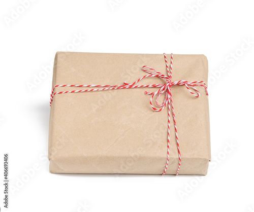 box wrapped in brown kraft paper and tied with red rope
