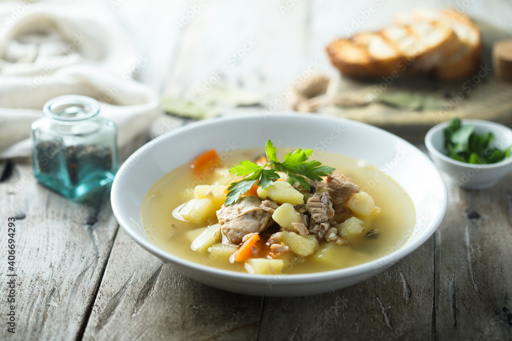 Traditional homemade fish soup with vegetables Traditional homemade fish soup with vegetables