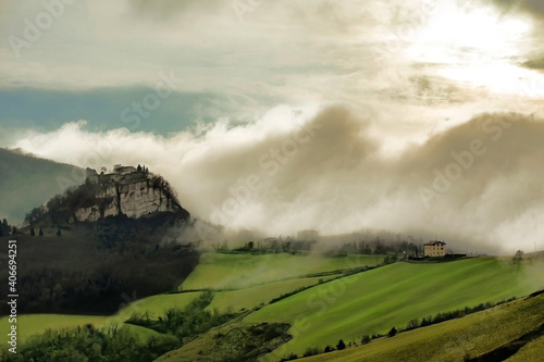 Scenic fog coming on italian hills and Canossa castle, Emilia Romagna photo