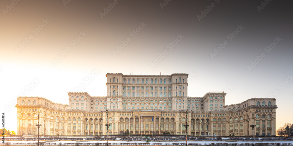 Palace of the Parliament building in Bucharest during an amazing winter sunset landscape landmark of Romania