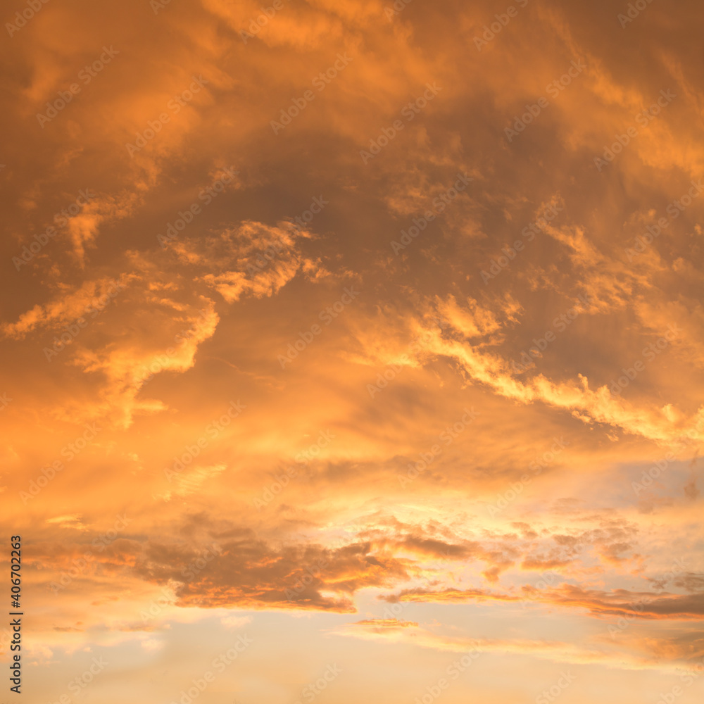 golden sunset scenery with bright illuminated clouds, soft sky background square format