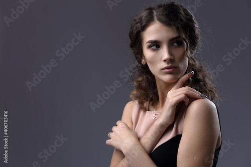Portrait of a beautiful girl on a light background
