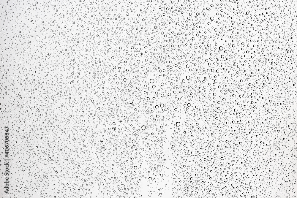 Obraz premium white isolated background water drops on the glass / wet window glass with splashes and drops of water and lime, texture autumn background