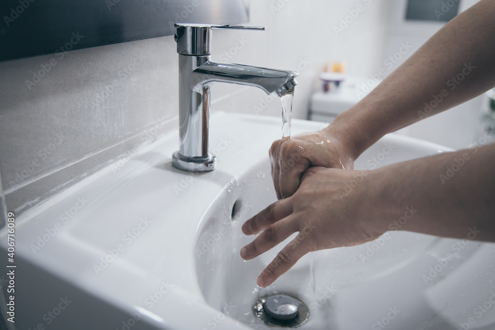 Men are washing their hands in the sinks to clear respiratory bacteria and viruses, sanitation and reduce the spread of COVID-19 that is spread around the world, Hygiene ,Sanitation concept. Men are washing their hands in the sinks to clear respiratory bacteria and viruses, sanitation and reduce the spread of COVID-19 that is spread around the world, Hygiene ,Sanitation concept.
