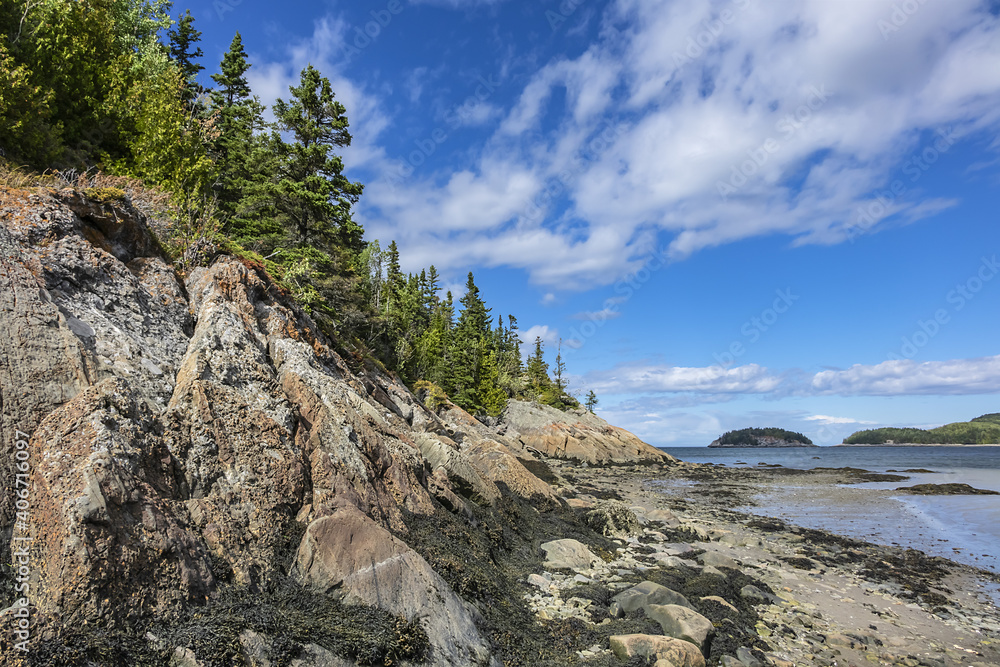 Picturesque View of the Bic Park (Parc national du Bic): rocks and forest on shore of the St. Lawrence River. Bas-Saint-Laurent tourism region near Rimouski, Quebec Province, Canada.