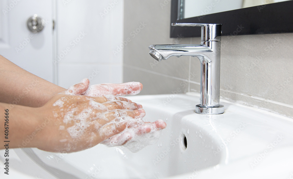 Men are washing their hands in the sinks to clear respiratory bacteria and viruses, sanitation and reduce the spread of COVID-19 that is spread around the world, Hygiene ,Sanitation concept. Men are washing their hands in the sinks to clear respiratory bacteria and viruses, sanitation and reduce the spread of COVID-19 that is spread around the world, Hygiene ,Sanitation concept.