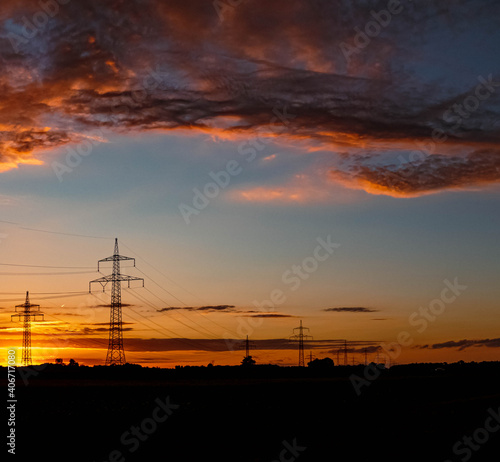 Beautiful summer sunset with high voltage overhead lines near Aholming, Bavaria, Germany