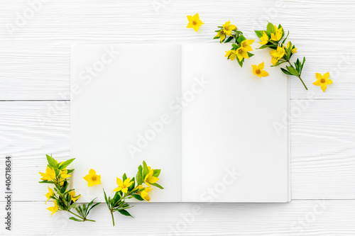 Spring card mockup with yellow flowers with leaves, top view