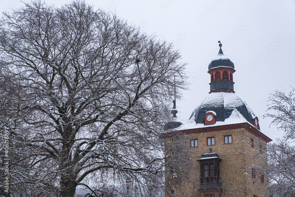View to the tower of Vollrads Castle in the Rheingau near Oestrich-Winkel / Germany in winter