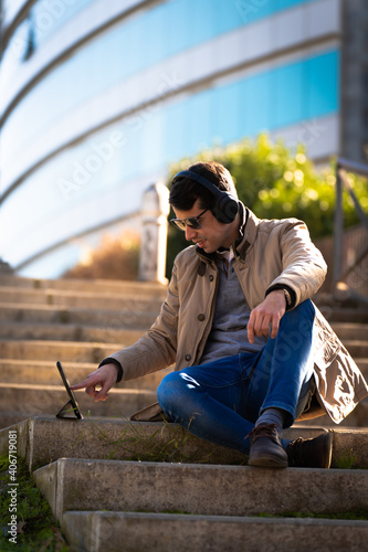 man using his tablet in a park