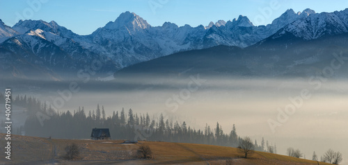 Fototapeta Naklejka Na Ścianę i Meble -  Beautiful panorama of mountains during a frosty, brilliant sunrise, Tatra Mountains, Poland	