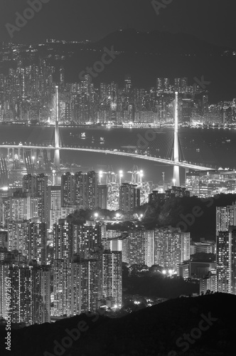 Aerial view of bridge and dowtown of Hong Kong city at night © leeyiutung