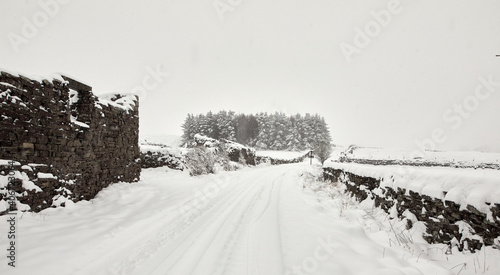 Heavy snow covers single tracked rural lane after daylong snowfall in Nidderdale © Fencewood studio