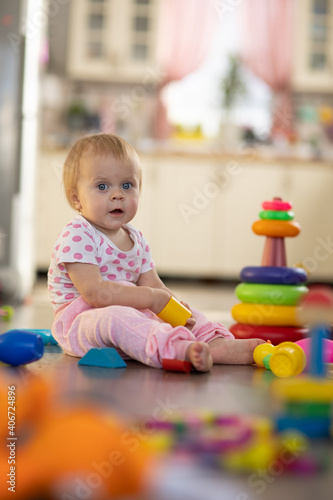 Baby one year old plays