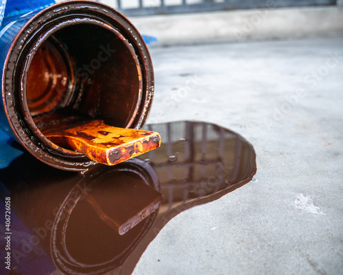 Spilled paint from the can on the cement floor