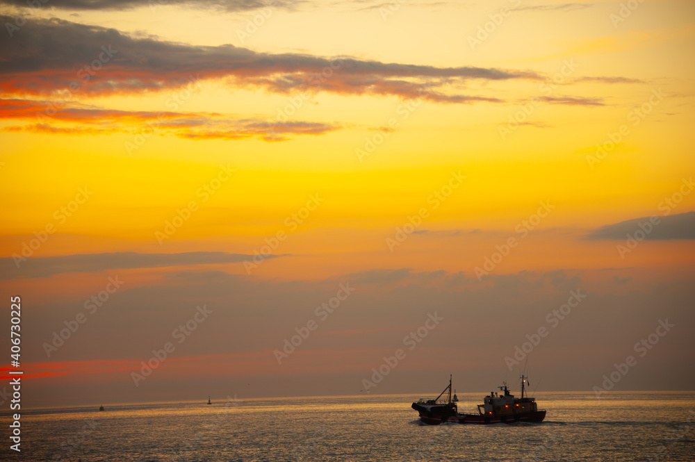 Sunset at at the fishing harbour around the sea coast