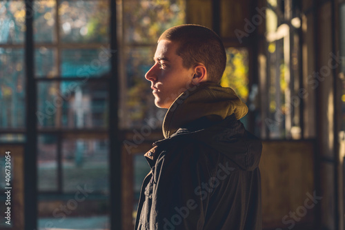 portrait of a young man in profile with evening sun