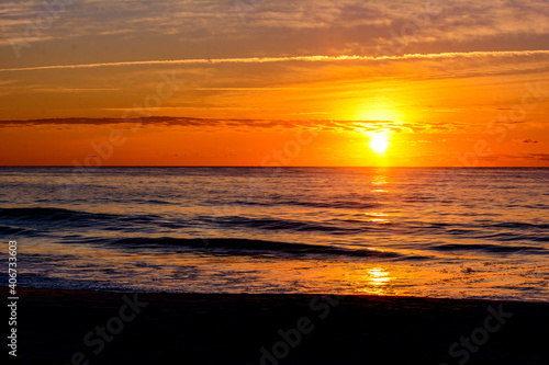 Beach sunrise over waves with clouds  Garden City Beach  South Carolina