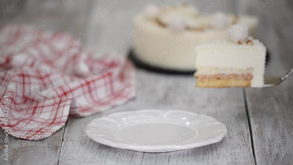 Piece of delicious coconut mousse cake with almonds. Piece of delicious coconut mousse cake with almonds.