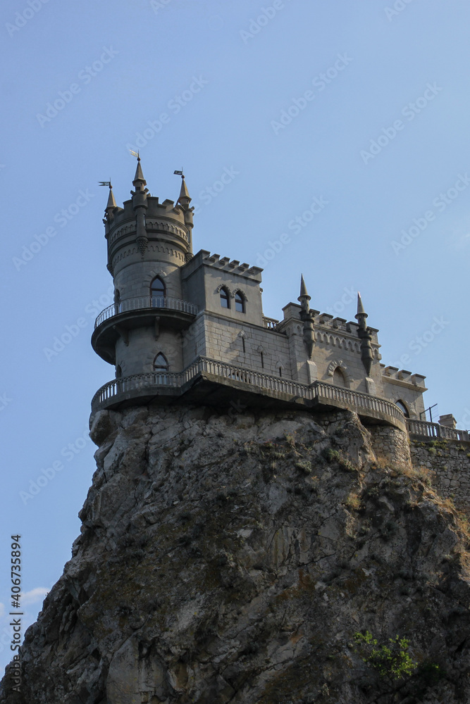 View of the Swallow's nest on a sunny day. Bright  blue sky without clouds on a summer day. 
