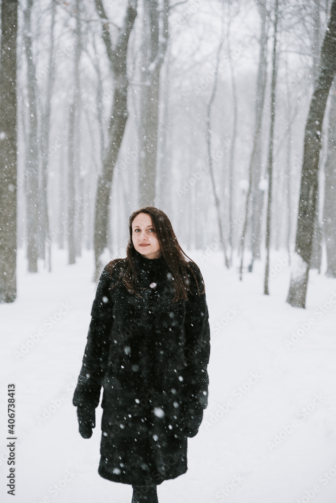 Portrait of a woman on the background of a snowy forest Portrait of a woman on the background of a snowy forest