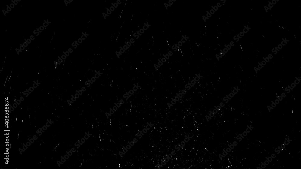 White snowflakes fly on black background White snowflakes fly on black background