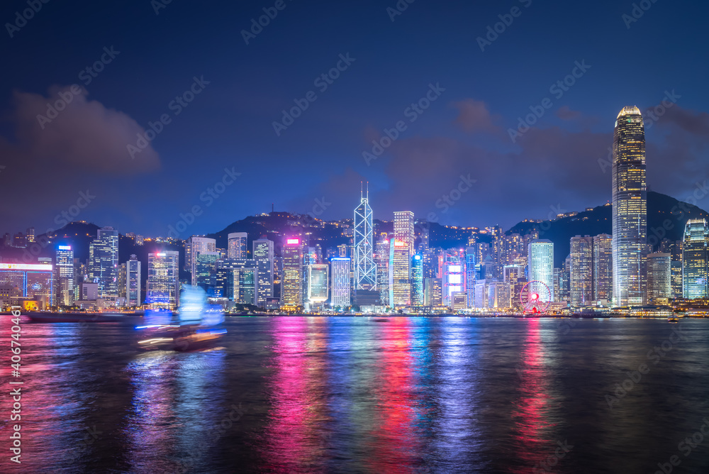 Fototapeta premium Skyline Hong Kong city at sunset view from harbor in Hong Kong.