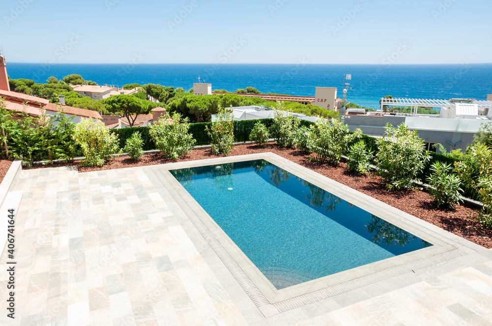 Fototapeta premium Beautiful pool overlooking the sea. Floor tiles non-slip.