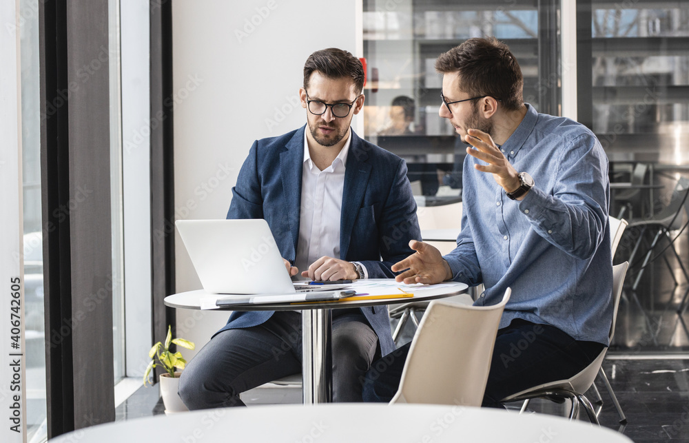 Couple of office workers discuss about stock market and new company project. Couple of office workers discuss about stock market and new company project.