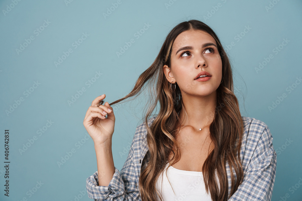 Fototapeta premium Thinking beautiful girl posing and looking upward