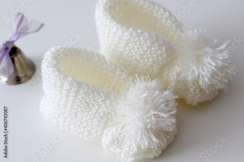hand knitted white wool baby shoes