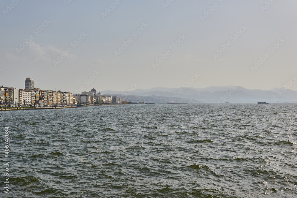 View of the city of Izmir. Panorama of Izmir in the afternoon from the sea.